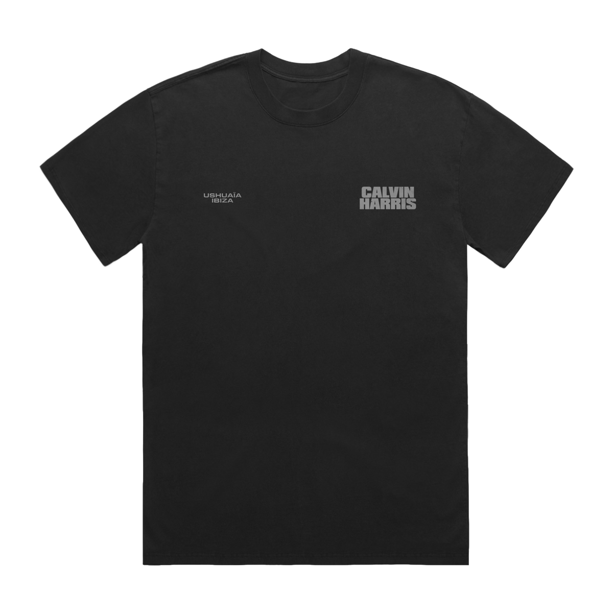 Black short-sleeve T-shirt with small grey “Ushuaïa Ibiza” text on the left chest and bold grey “Calvin Harris” text on the right chest.